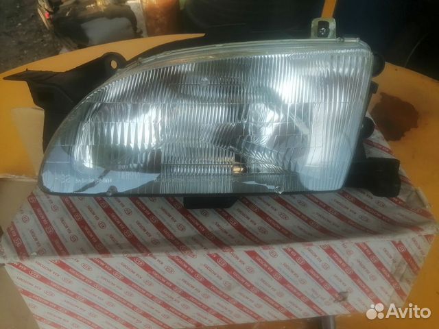 Новая оригинальная фара левая Kia Avella